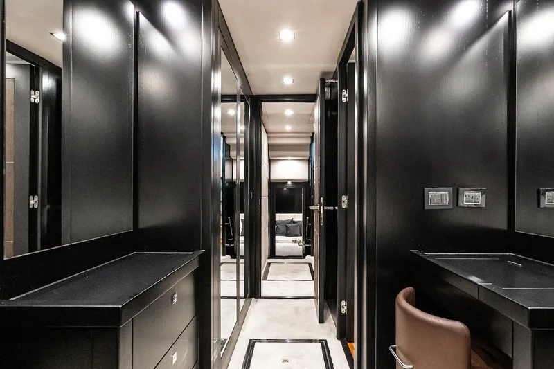 Norma Jean Yacht Photos Pics Luxurious interior of 2007 Sunseeker Predator 82 yacht with sleek black cabinetry.