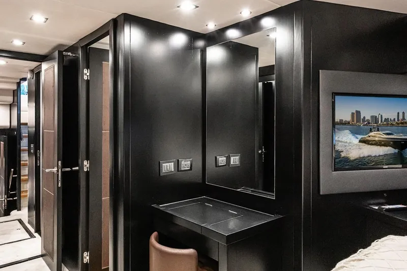 Norma Jean Yacht Photos Pics Luxurious interior of 2007 Sunseeker Predator 82 yacht with sleek black design and modern amenities.