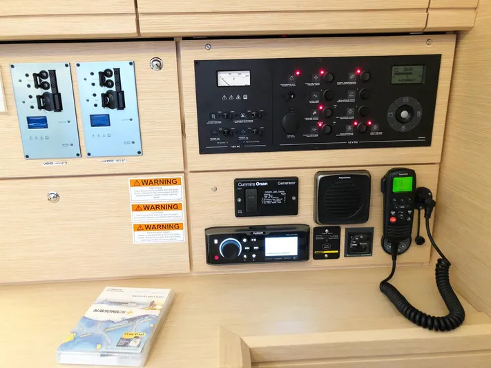 Caretta2 Yacht Photos Pics Control panel of a 2018 Jeanneau 54 yacht with navigation and communication equipment.