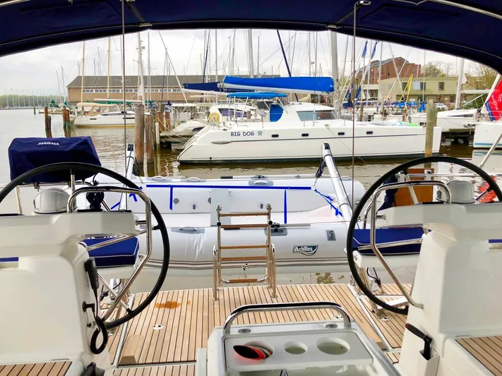 Caretta2 Yacht Photos Pics Jeanneau 54 sailboat cockpit view, marina background, 2018 model.