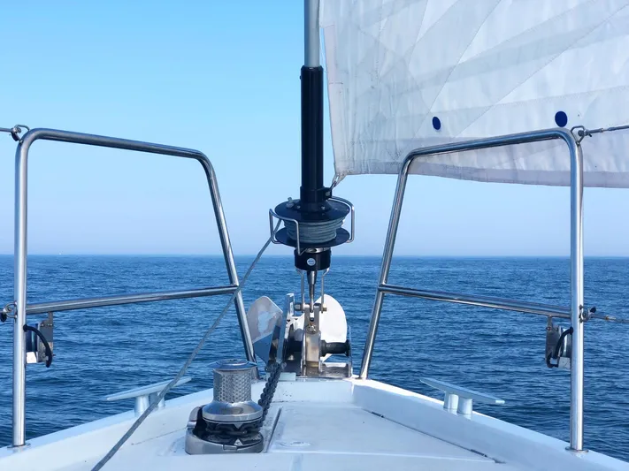 Caretta2 Yacht Photos Pics Jeanneau 54 sailboat bow view on open sea, 2018 model.
