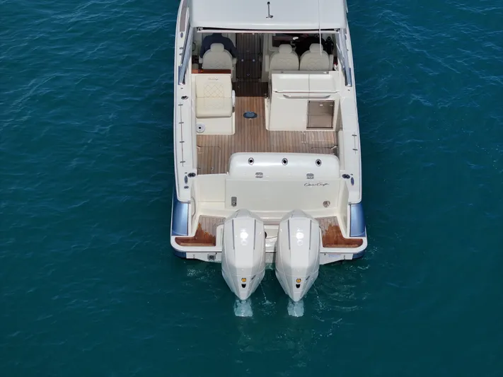  Yacht Photos Pics 2022 Chris-Craft Calypso 30 boat on clear blue water, rear view with dual engines.