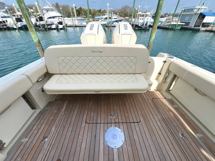  Yacht Photos Pics 2022 Chris-Craft Calypso 30 boat with teak deck and cushioned seating at marina.