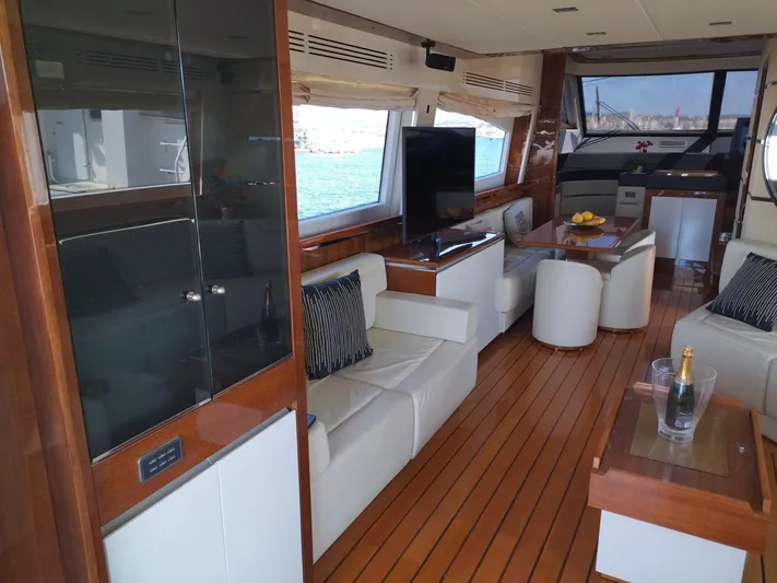  Yacht Photos Pics Luxurious interior of 2009 Leonard 66 yacht with elegant seating and modern amenities.