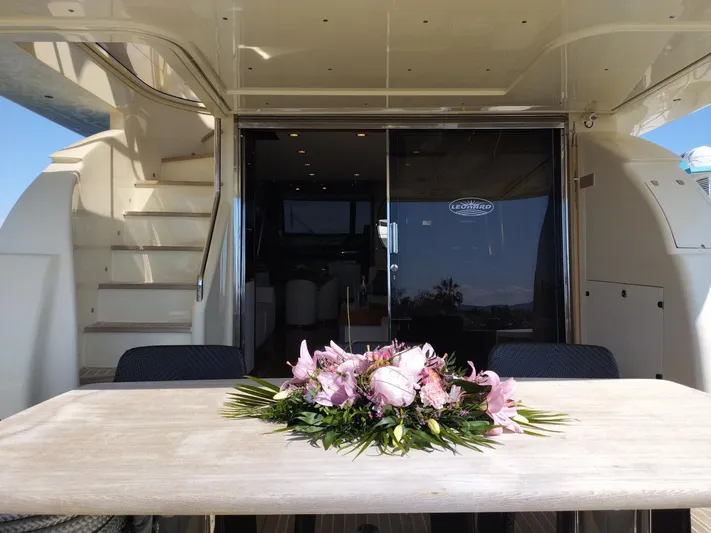  Yacht Photos Pics Luxurious Leonard 66 yacht interior with elegant floral centerpiece, 2009 model.