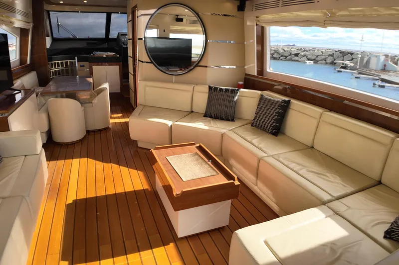  Yacht Photos Pics Luxurious interior of 2009 Leonard 66 yacht with leather seating and ocean view.