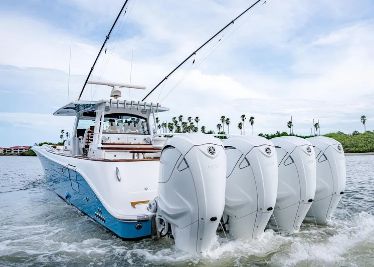  Yacht Photos Pics 2020 HCB Suenos boat with four powerful outboard engines cruising on water.