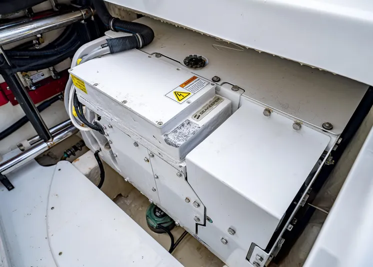  Yacht Photos Pics Engine compartment of a 2020 HCB Suenos boat, showcasing mechanical components and wiring.