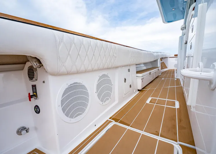  Yacht Photos Pics 2020 HCB Suenos boat interior with white seating and wooden deck.