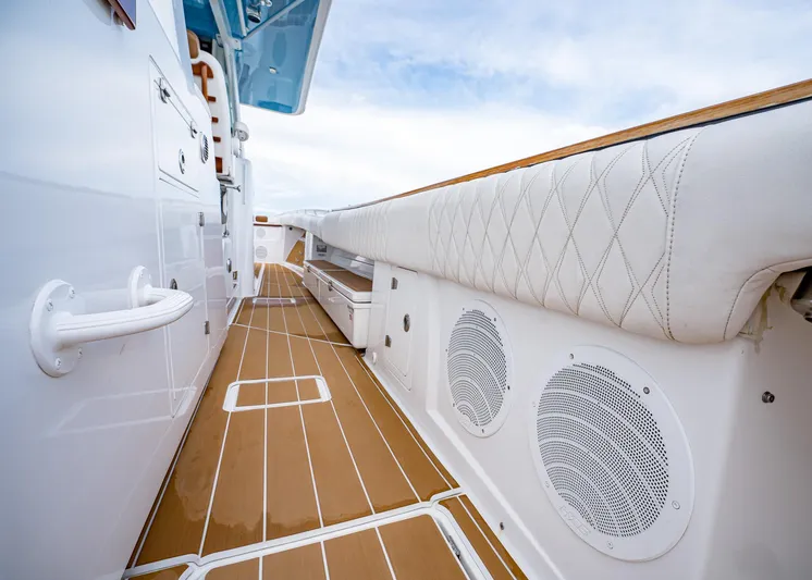  Yacht Photos Pics 2020 HCB Suenos boat interior with cushioned seating and wooden flooring.