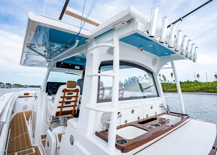  Yacht Photos Pics 2020 HCB Suenos boat with sleek design, featuring fishing rod holders and luxurious seating.