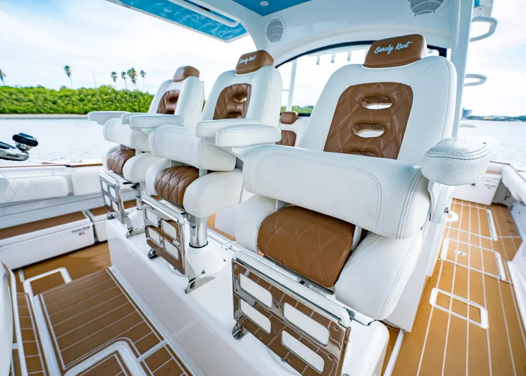  Yacht Photos Pics Luxury seating on 2020 HCB Suenos boat with brown and white leather upholstery.