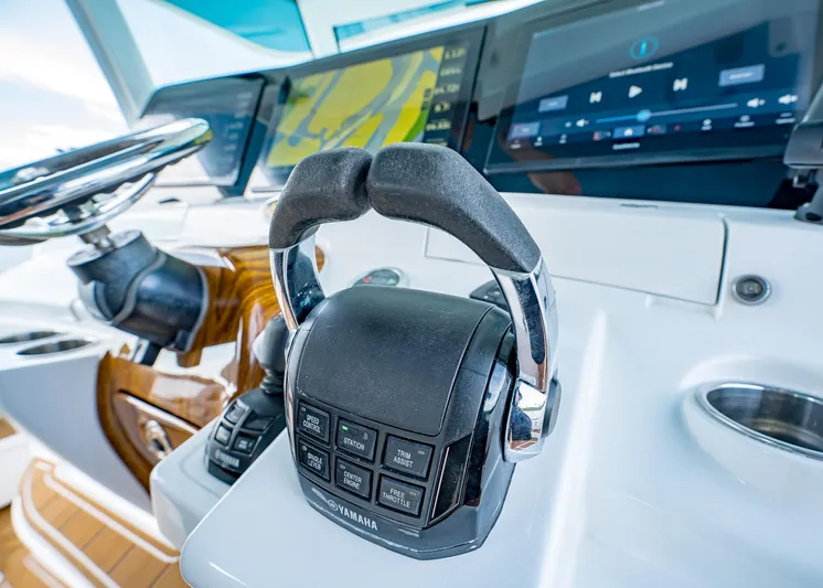  Yacht Photos Pics Control panel of 2020 HCB Suenos boat with steering wheel and navigation display.
