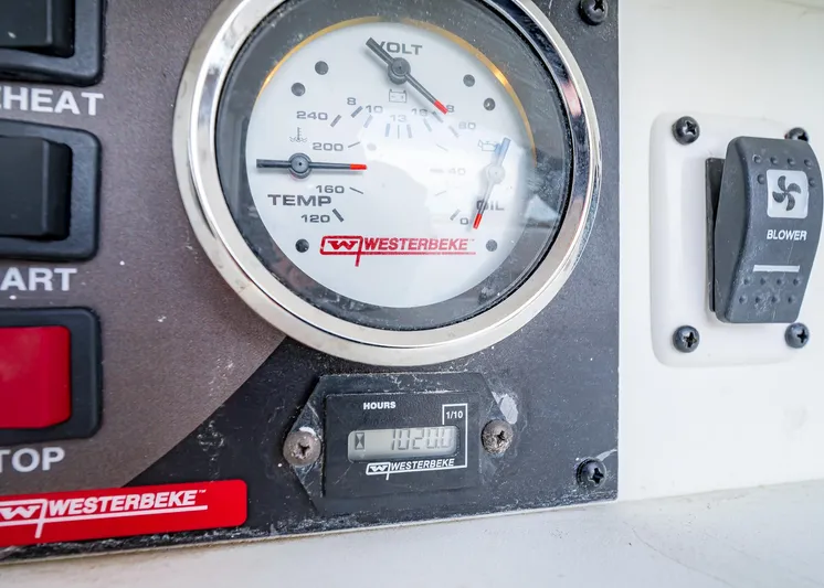  Yacht Photos Pics Control panel of a 2020 HCB Suenos boat featuring Westerbeke gauges and blower switch.