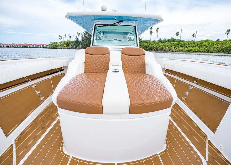  Yacht Photos Pics 2020 HCB Suenos boat with luxurious tan seating and sleek design on the water.