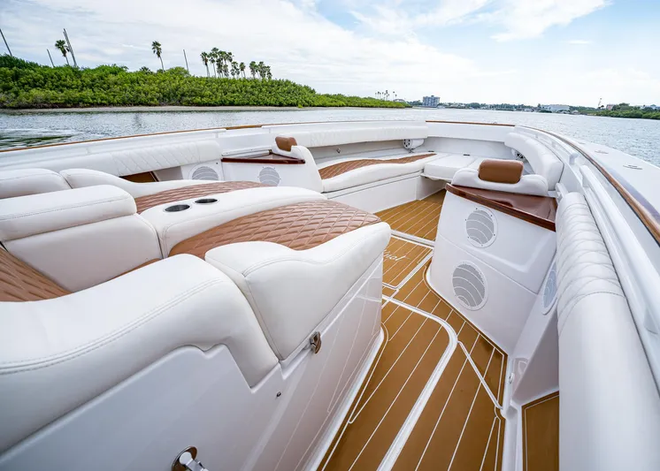  Yacht Photos Pics 2020 HCB Suenos boat interior with luxurious seating and wood accents on a sunny day.