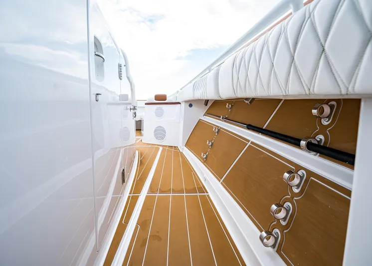  Yacht Photos Pics 2020 HCB Suenos boat interior with white seating and wooden flooring.