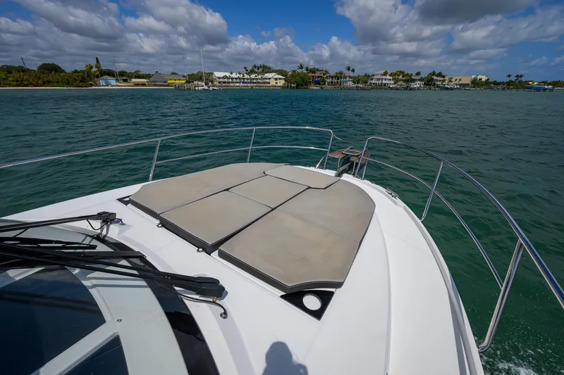 Don't Wake Me Yacht Photos Pics 2022 Jeanneau NC Weekender 1095 Fly cruising on a sunny day with scenic coastal view.