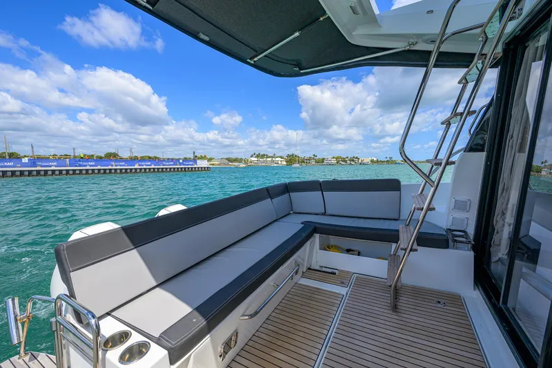 Don't Wake Me Yacht Photos Pics 2022 Jeanneau NC Weekender 1095 Fly, spacious deck with seating, ocean view.