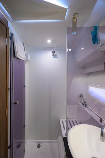 Don't Wake Me Yacht Photos Pics 2022 Jeanneau NC Weekender 1095 Fly bathroom with modern fixtures and sleek design.