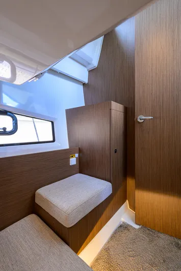 Don't Wake Me Yacht Photos Pics Interior of 2022 Jeanneau NC Weekender 1095 Fly, featuring cozy seating and modern design.