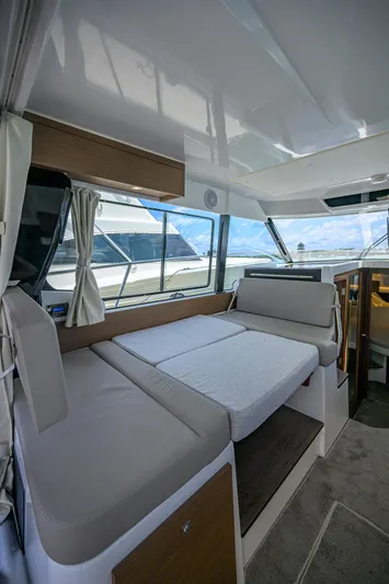 Don't Wake Me Yacht Photos Pics 2022 Jeanneau NC Weekender 1095 Fly interior with seating and windows.