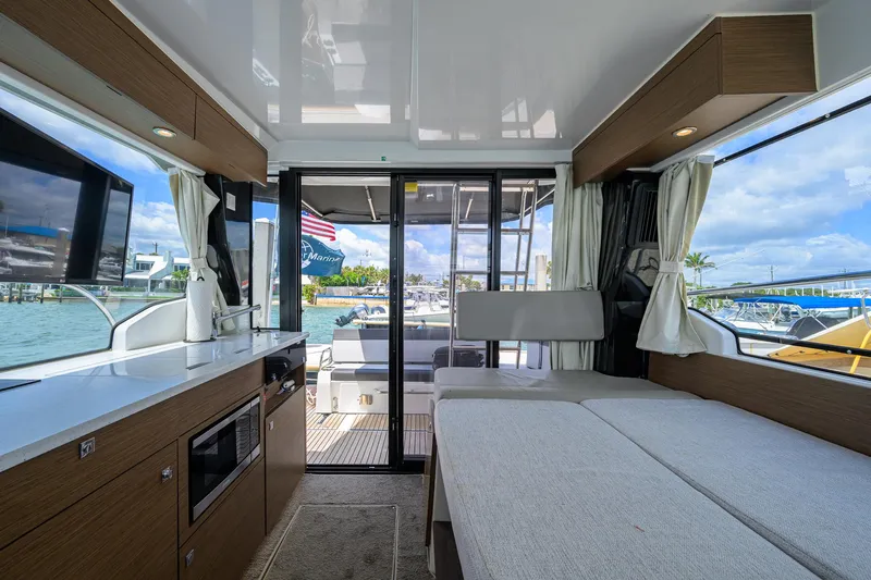 Don't Wake Me Yacht Photos Pics Interior of 2022 Jeanneau NC Weekender 1095 Fly, featuring modern design and waterfront view.