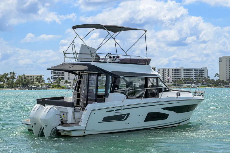 Don't Wake Me Yacht Photos Pics 2022 Jeanneau NC Weekender 1095 Fly boat on water, with modern design and twin engines.