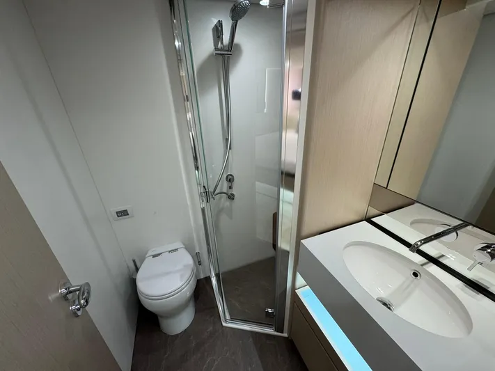  Yacht Photos Pics 2024 Azimut Fly 68 yacht bathroom with modern shower, toilet, and sleek vanity.