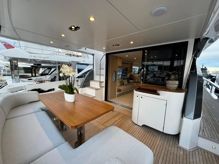  Yacht Photos Pics Luxurious 2024 Azimut Fly 68 yacht interior with elegant seating and dining area.
