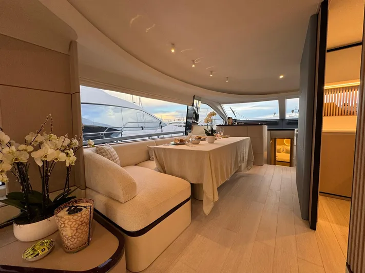  Yacht Photos Pics Luxurious interior of 2024 Azimut Fly 68 yacht with elegant dining area and panoramic windows.
