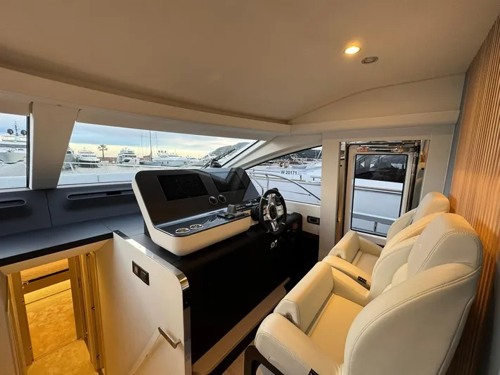 Yacht Photos Pics Luxurious interior of 2024 Azimut Fly 68 yacht with modern helm and plush seating.