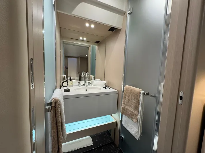  Yacht Photos Pics Luxurious bathroom in 2024 Azimut Fly 68 yacht with modern fixtures and elegant design.