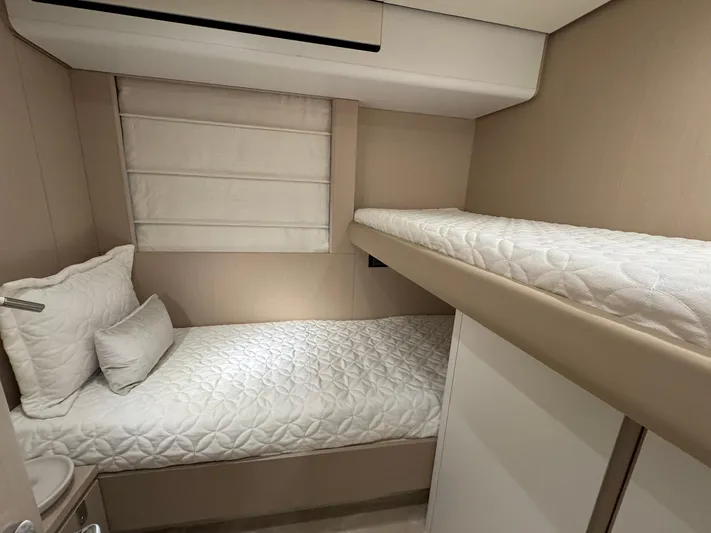  Yacht Photos Pics 2024 Azimut Fly 68 yacht cabin with twin beds and modern decor.