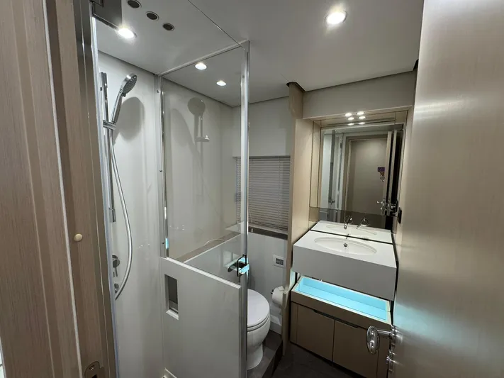  Yacht Photos Pics Luxurious bathroom in 2024 Azimut Fly 68 yacht with modern fixtures and sleek design.