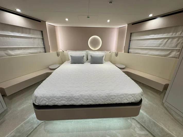  Yacht Photos Pics Luxurious bedroom interior of 2024 Azimut Fly 68 yacht with modern design and ambient lighting.