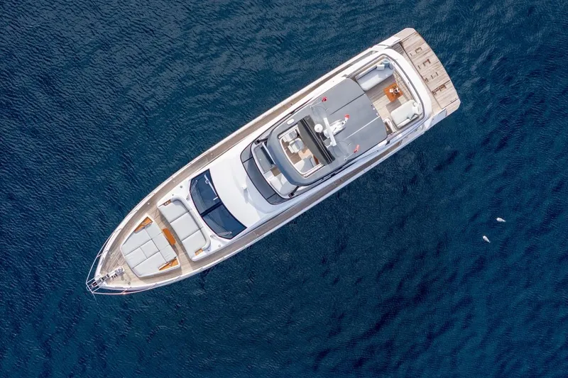  Yacht Photos Pics Aerial view of 2024 Azimut Fly 68 yacht on deep blue ocean water.
