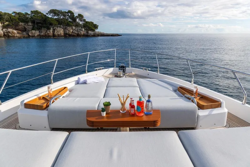  Yacht Photos Pics Luxurious 2024 Azimut Fly 68 yacht deck with sun loungers and ocean view.