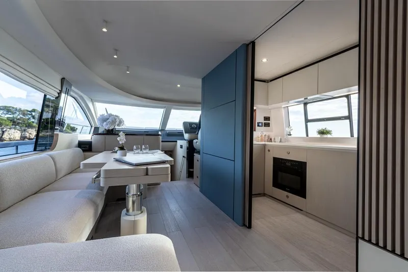  Yacht Photos Pics Luxurious interior of 2024 Azimut Fly 68 yacht with modern kitchen and seating area.
