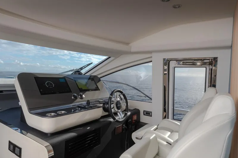  Yacht Photos Pics 2024 Azimut Fly 68 yacht cockpit with modern controls and ocean view.