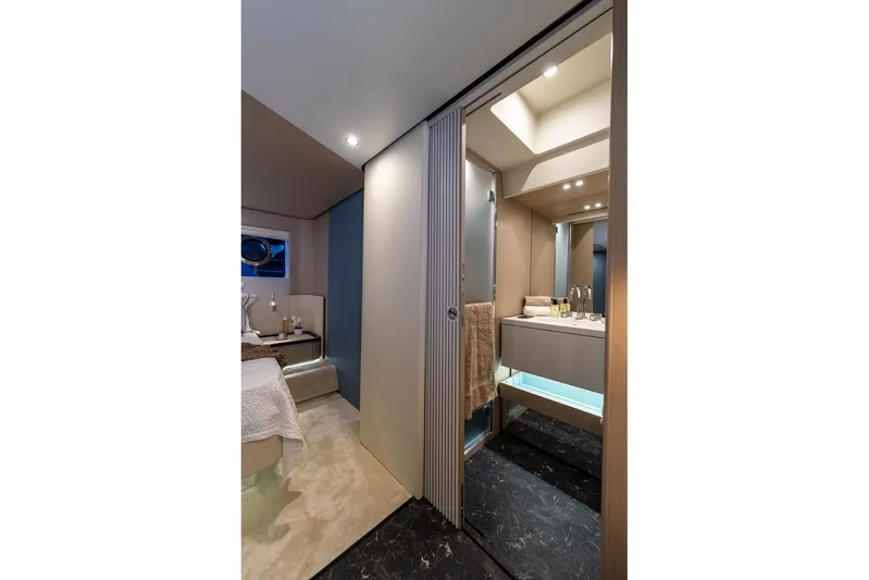  Yacht Photos Pics Luxurious interior of 2024 Azimut Fly 68 yacht, featuring modern bathroom and cozy bedroom.