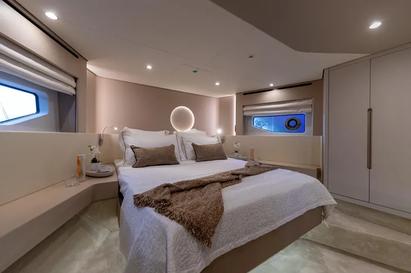  Yacht Photos Pics Luxurious bedroom interior of 2024 Azimut Fly 68 yacht, featuring elegant design and cozy ambiance.