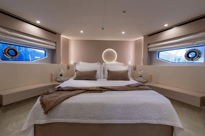  Yacht Photos Pics Luxurious bedroom interior of 2024 Azimut Fly 68 yacht with elegant decor and ambient lighting.