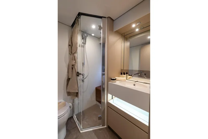  Yacht Photos Pics Luxurious bathroom in 2024 Azimut Fly 68 yacht with modern shower and vanity.