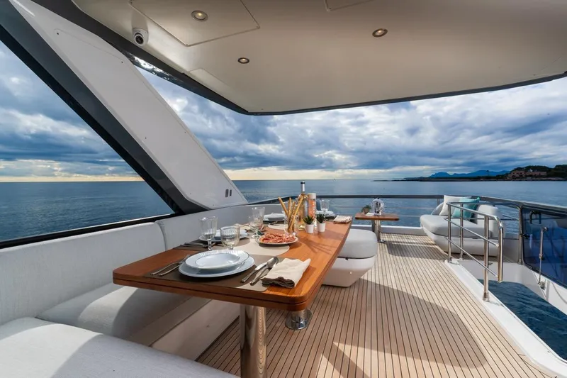  Yacht Photos Pics Luxurious dining area on 2024 Azimut Fly 68 yacht with ocean view.