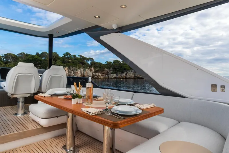  Yacht Photos Pics Luxurious dining area on 2024 Azimut Fly 68 yacht with scenic ocean view.