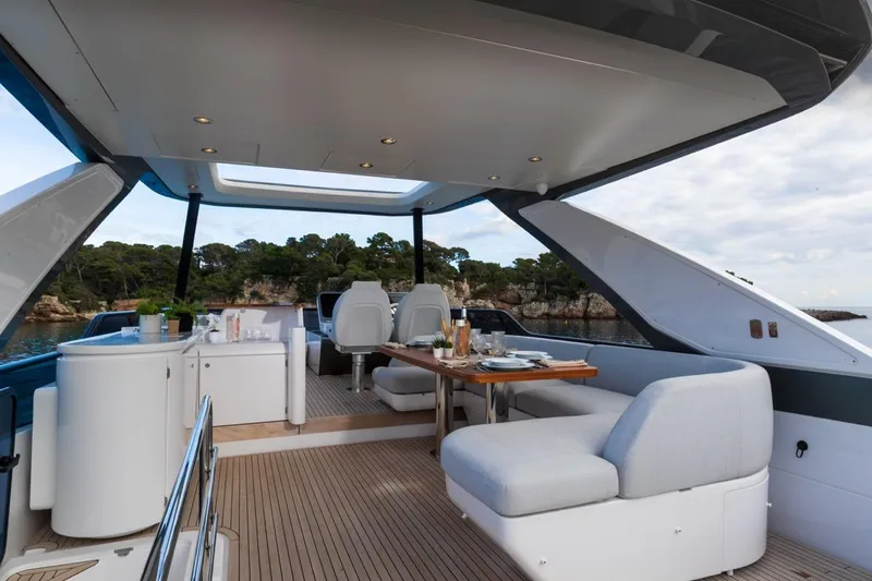  Yacht Photos Pics Luxurious 2024 Azimut Fly 68 yacht interior with elegant seating and dining area.