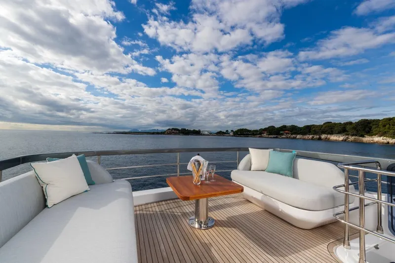  Yacht Photos Pics Luxurious deck of 2024 Azimut Fly 68 yacht with ocean view and elegant seating.