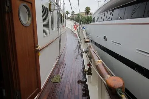  Yacht Photos Pics 1962 Custom Southern yacht deck with wooden flooring and adjacent modern vessel.