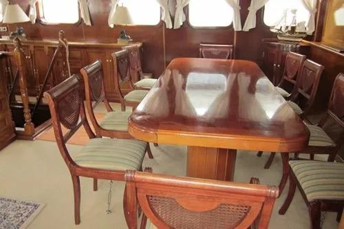  Yacht Photos Pics Luxurious 1962 Custom Southern yacht interior with elegant wooden dining area.